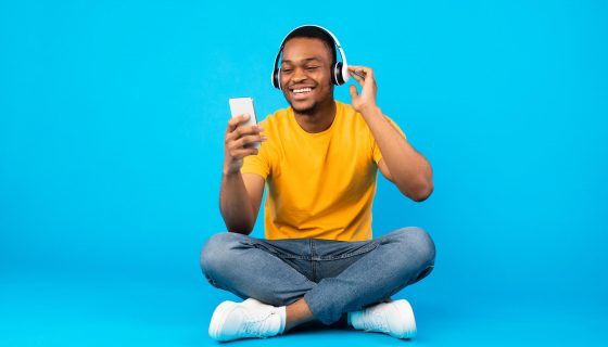 african-guy-listening-music-using-smartphone-weari-2021-09-03-07-41-56-utc-pvsn5swwox4b10jsd4femsynpriyvukxflthyooz9c